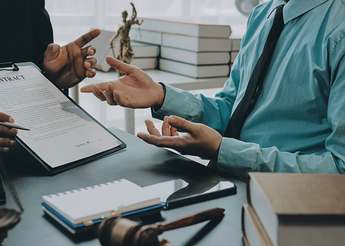 Professionals reviewing documents representing bankruptcy strategy and exemption planning