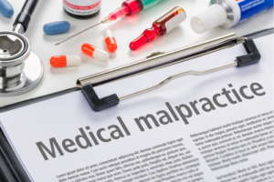 medical malpractice document with pills and medical devices
